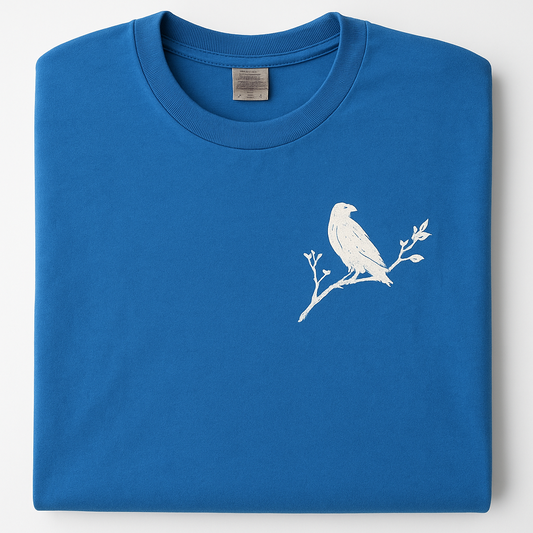 Blue t-shirt with a white bird design on a white background
