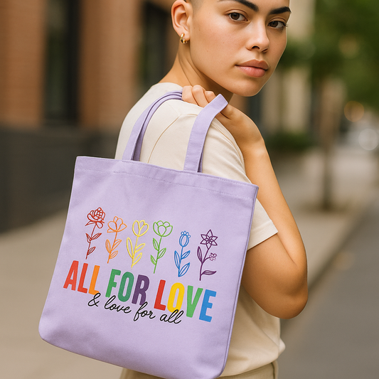 Person holding a purple tote bag with colorful floral designs and text.